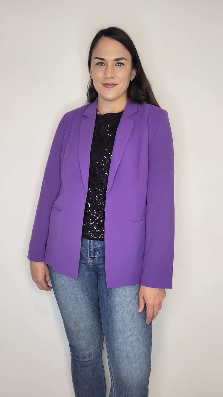 Details: The prettiest quality blazer to add to your closet! The purple is gorgeous and the lining throughout with purple and white stripes is the chef's kiss! The sleeves are full length, but can be cuffed to show off the beautiful lining. Pockets are functional and the flap can be tucked or untucked. Lightweight, comfortable, and smooth material. Light shoulder pads. Collared. Pair it with heels and dress pants or wear it more casual with jeans and sneakers. It would be perfect for kstate fans with a kstate graphic tee. Materials: Self: 100% Polyester. Lining: 95% Polyester, 5% Spandex Made In: China Sizing Tip: It fits like a traditional blazer. Meant to be more fitted. Order true to size or size up if inbetween. There is a little give to the material, but not much. I am 5’7” about 165 Purple Tailored Outerwear With Notch Lapel, Tailored Purple Outerwear With Notch Lapel, Elegant Lavender Long-sleeve Blazer, Elegant Lavender Long Sleeve Blazer, Elegant Long Sleeve Lavender Blazer, Lavender Long Sleeve Blazer For Spring, Long Sleeve Lavender Blazer For Spring, Purple Notch Lapel Blazer For Spring, Purple Notch Lapel Outerwear For Work