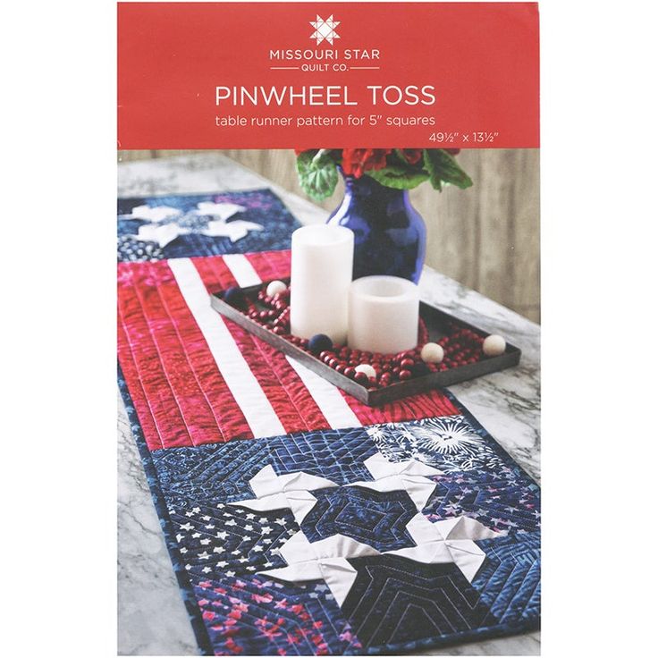 a table runner made with red, white and blue quilts is featured in the book pinwheel toss