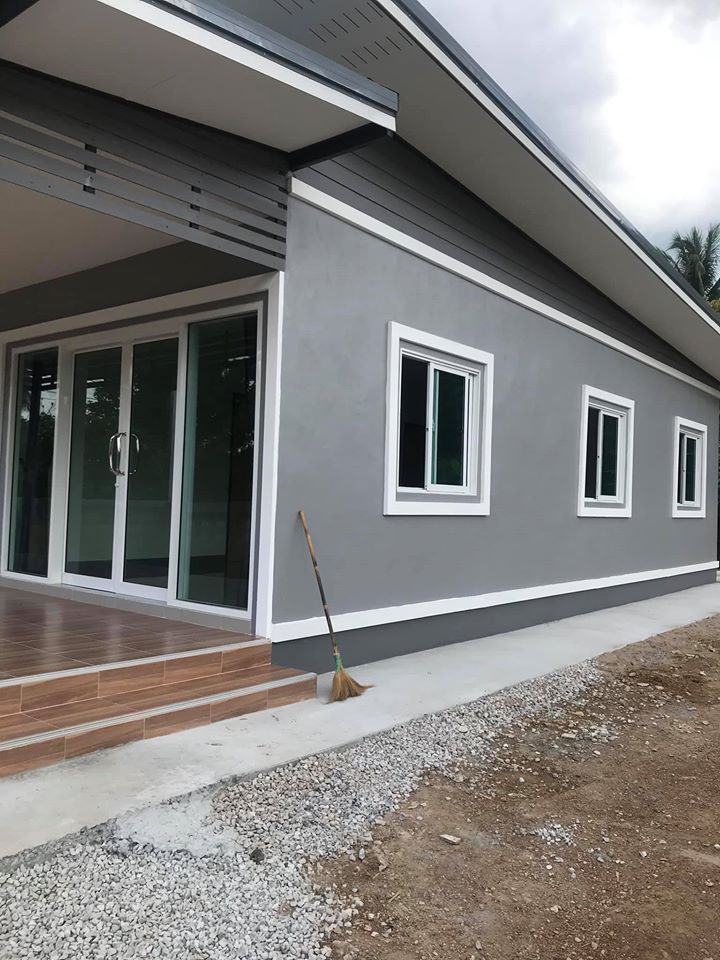 a house that has been painted gray and white