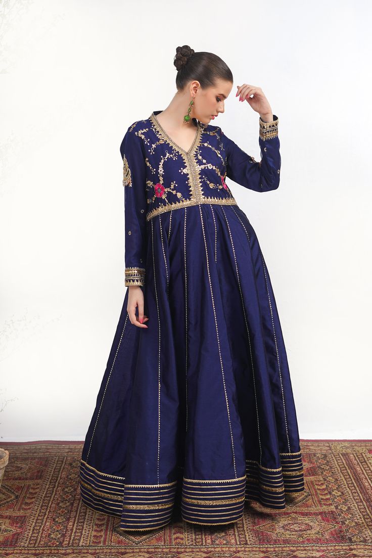 A royal blue frock in raw silk with embroidery on the bodice and a matching net dupatta with kiran along its width. Finished with a jamawar trouser for a regal touch.3-piece suitReady to wear Royal Blue Dabka Work Sets For Eid, Royal Blue Semi-stitched Set For Eid, Royal Blue Sets With Dabka Work For Eid, Designer Blue Anarkali Set With Intricate Embroidery, Blue Jamawar Wedding Dress, Elegant Jamawar Dresses With Zari Work, Elegant Unstitched Royal Blue Traditional Wear, Blue Jamawar Salwar Kameez For Wedding, Blue Jamawar Anarkali Set For Wedding