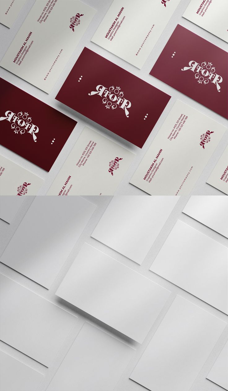 several white and red business cards on top of each other, with the word's logo