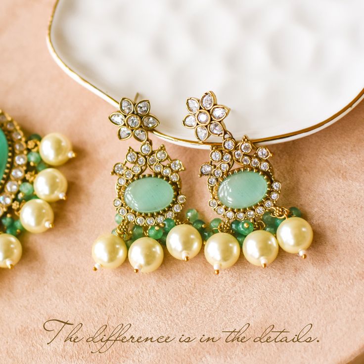 Elevate your style with our Mughal masterpiece - where heritage meets modern elegance! Crafted with precision and elegance, this set captures the opulence of Mughal aesthetics, combining vibrant pumpkin green beads and sparkling CZ stones along with intricately designed mala accompanied by dangling cream-colored pearls, this set epitomizes grace and sophistication, making it a statement piece for any occasion. The set includes a mala and a pair of earrings. Please click on the video for a detail Colored Pearls, Unique Gift Cards, Green Beads, Faux Stone, Pearl Color, Green Bead, Cz Stone, Modern Elegance, Base Metal