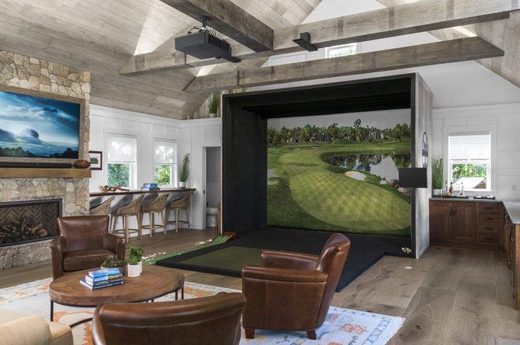 a living room filled with furniture and a painting on the wall