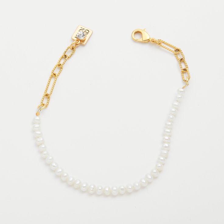 Delicate fresh water pearls and a pretty, rope-textured chain are a timeless combination. Perfect for stacking and adding charms--either one between the pearls, or several along the chain. Materials: 6.75-7.75" Overall Gold-Plated Brass Lobster Clasp Closure Genuine fresh water pearls Elegant Charm Bracelet With Pearl And Round Beads, Delicate Baroque Pearl Bracelet With Pearl Chain, Delicate Baroque Pearl Chain Bracelet, Delicate Baroque Pearl Bracelet, White Pearl Bracelet With Adjustable Chain, White Pearl Bracelet With Chain Detail, White Pearl Bracelet With Chain, Classic White Chain Bracelet With Pearl Drop, Classic White Pearl Chain Bracelet