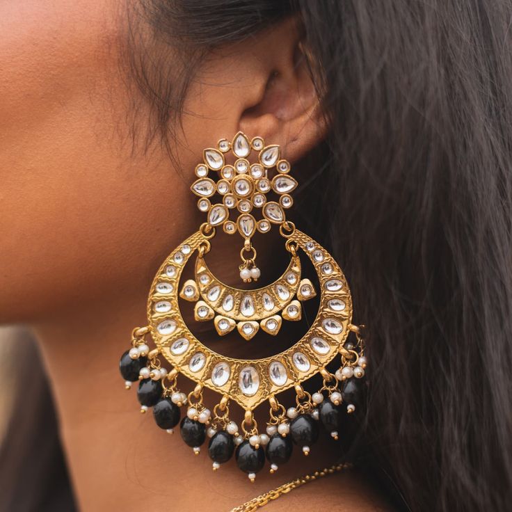 Introducing our exquisite Gold Chandbali Earrings, a perfect blend of traditional charm and modern elegance. Adorned with radiant Kundan stones and delicate pearls, these earrings are a true testament to the rich heritage of Indian and Pakistani jewelry. Ideal for bridesmaids and special occasions, their intricate design and shimmering gold finish will elevate any outfit. Embrace the timeless beauty and sophistication of our Gold Chandbali Earrings, a must-have addition to your jewelry collectio Big Kundan Earrings, Gold Chandbali Earrings, Gold Chandbali, Chandbali Earrings, Traditional Earrings, Pakistani Jewelry, Kundan Earrings, Fancy Jewellery, Ear Rings