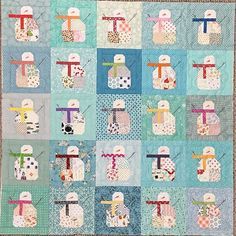 a patchwork quilt with snowmen on it