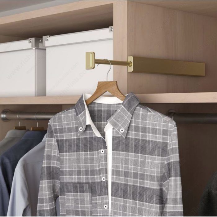 a shirt hanging on a clothes rack in a closet