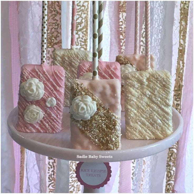 some pink and gold cakes on a white plate