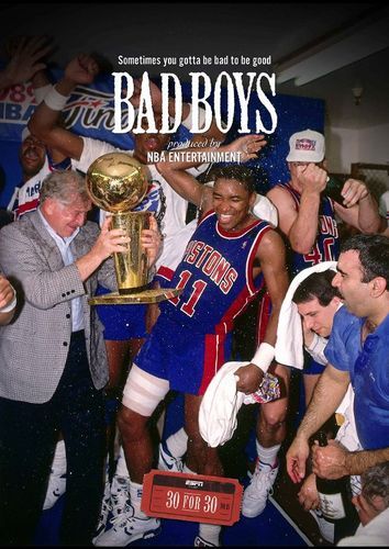 a group of men standing next to each other in front of a trophy and people