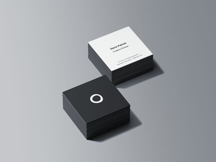 two black and white business cards sitting on top of each other with the letter o