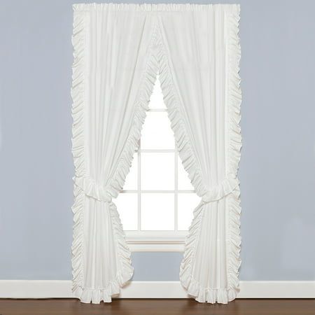 a white window curtain with ruffled edges