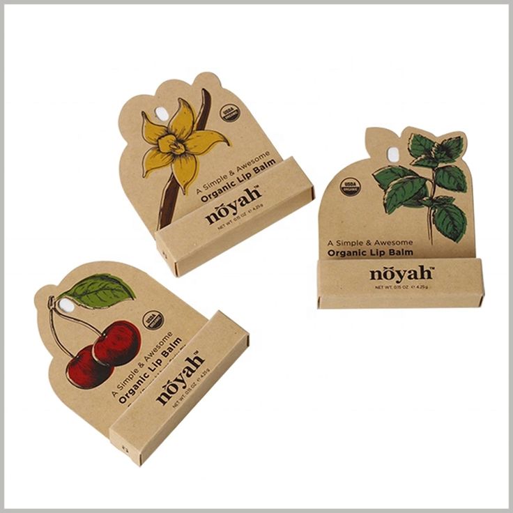 three small boxes with labels on them that include cherries, leaves, and flowers