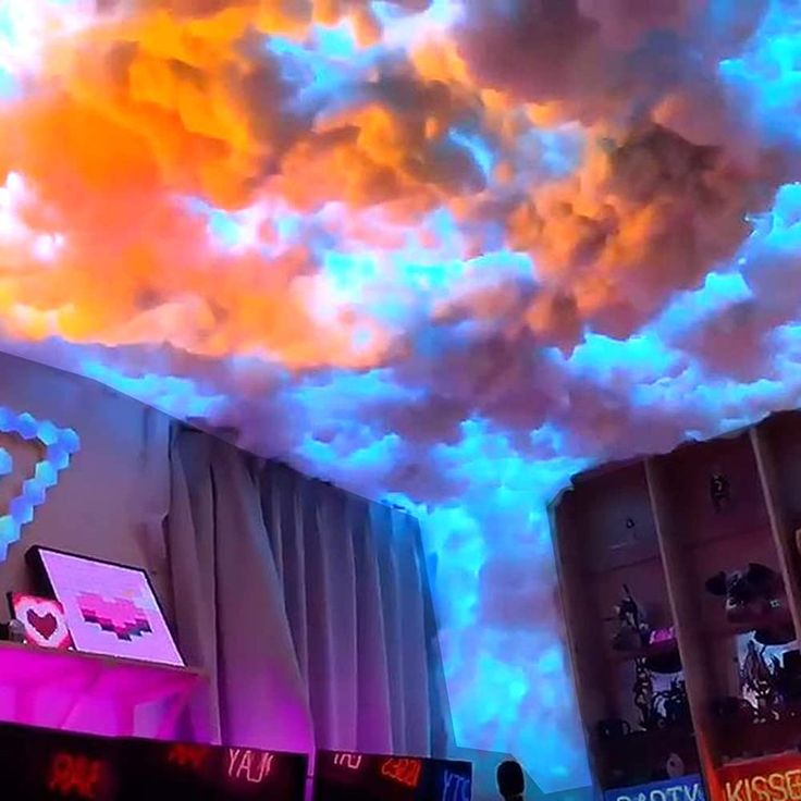 the ceiling is covered in colorful clouds and lights