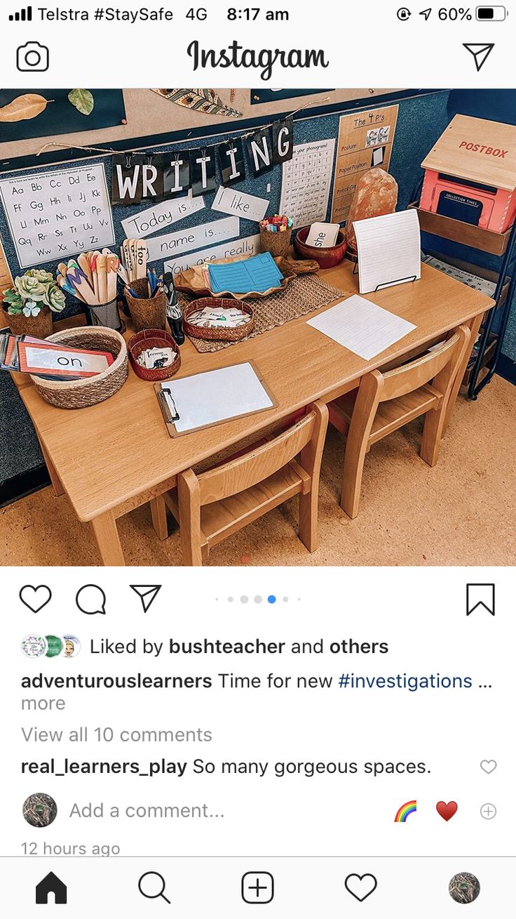 an instagram page for writing on the computer screen, with two tables and chairs in front of it