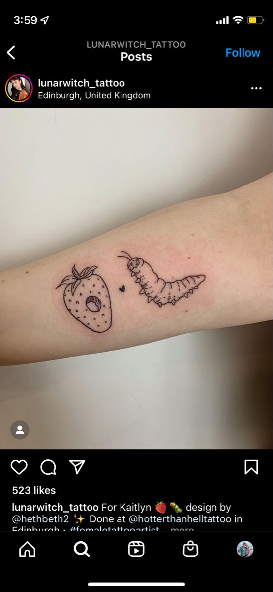 a tattoo on the arm of a person with a strawberry and an antelope