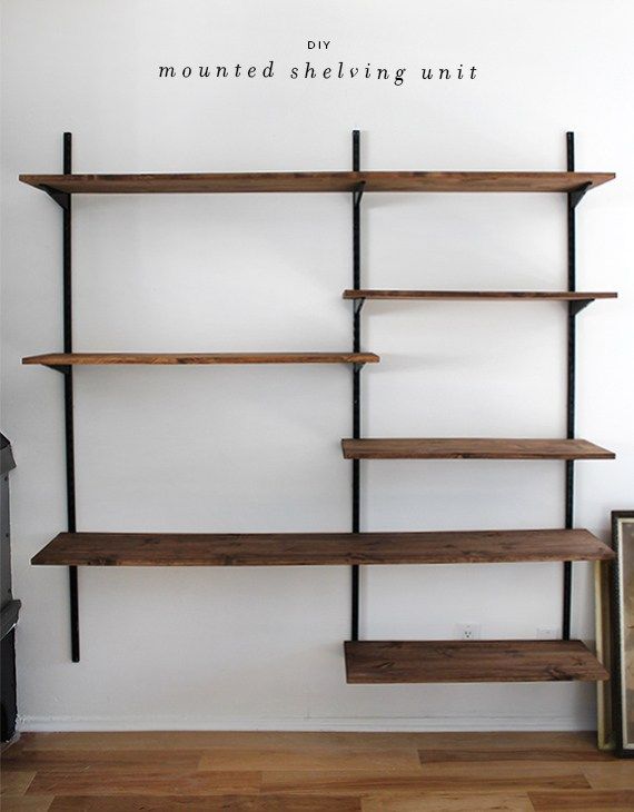 an empty shelf in the corner of a room