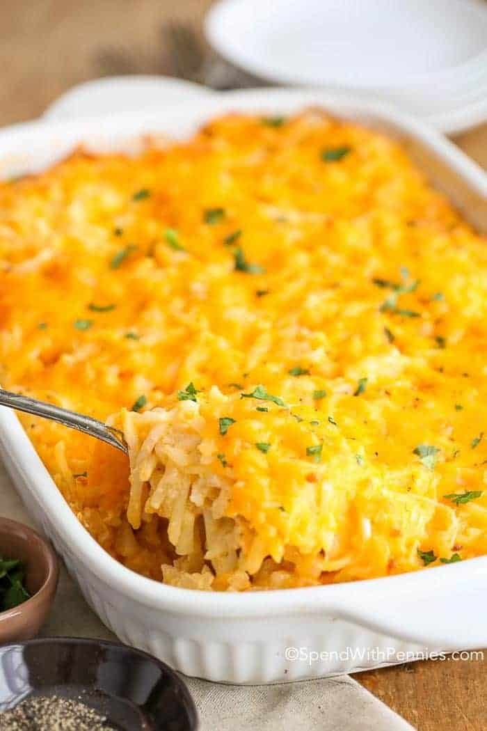 a casserole dish filled with mashed potatoes and garnished with parsley