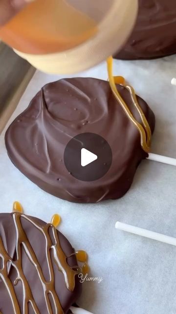 chocolate covered pretzels being drizzled with caramel