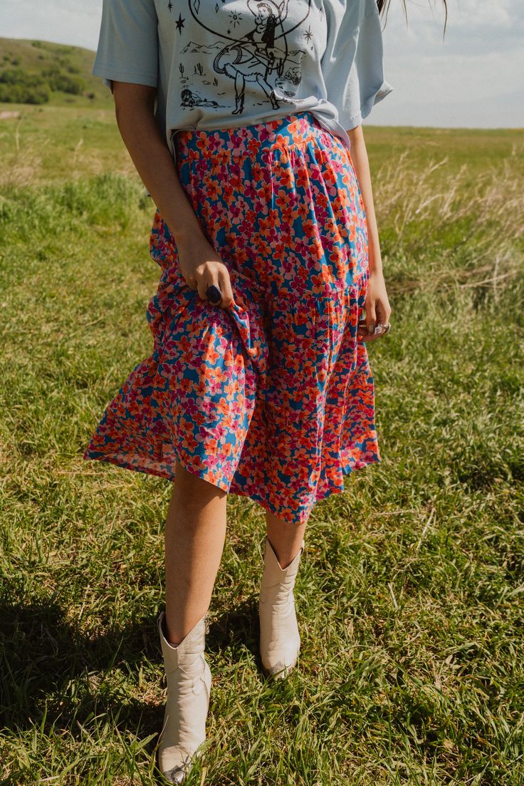 The floral skirt is everything we've wanted and more! Fun, vibrant colors for the win. Midi skirt 100% rayon Elastic waistband Model is 5'3" and wearing a size small. The length of a size small measures 33". X-Small: 0-2 Small: 2-4 Medium: 6-8 Large: 10-12 Multicolored Skirt Outfit, Summer Relaxed Fit Rayon Maxi Skirt, Summer Rayon Maxi Skirt For Day Out, Summer Day Out Maxi Skirt, Summer Rayon Lined Maxi Skirt, Summer Rayon Maxi Skirt, Summer Gathered Skirt In Rayon, Summer Rayon Gathered Skirt, Floral Print Flowy Skirt