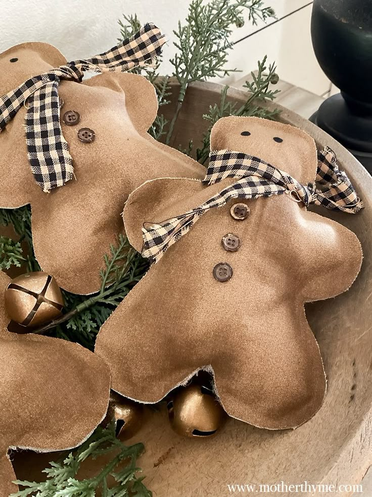 some ornaments are sitting in a bowl on the table