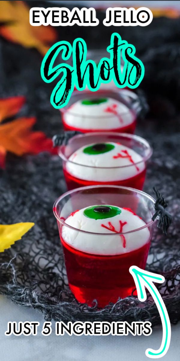 three glasses filled with halloween jello sitting on top of a table