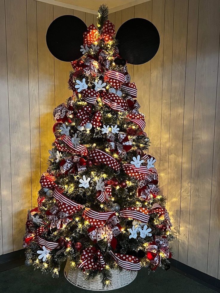 a decorated christmas tree with mickey mouse ears