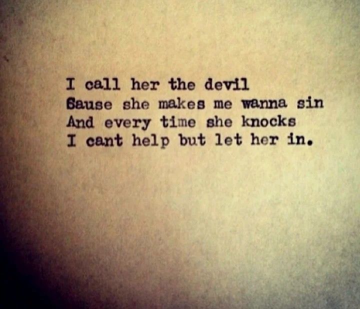 an old typewriter with the words, i call her the devil because she makes me wanna sin and every time she knocks