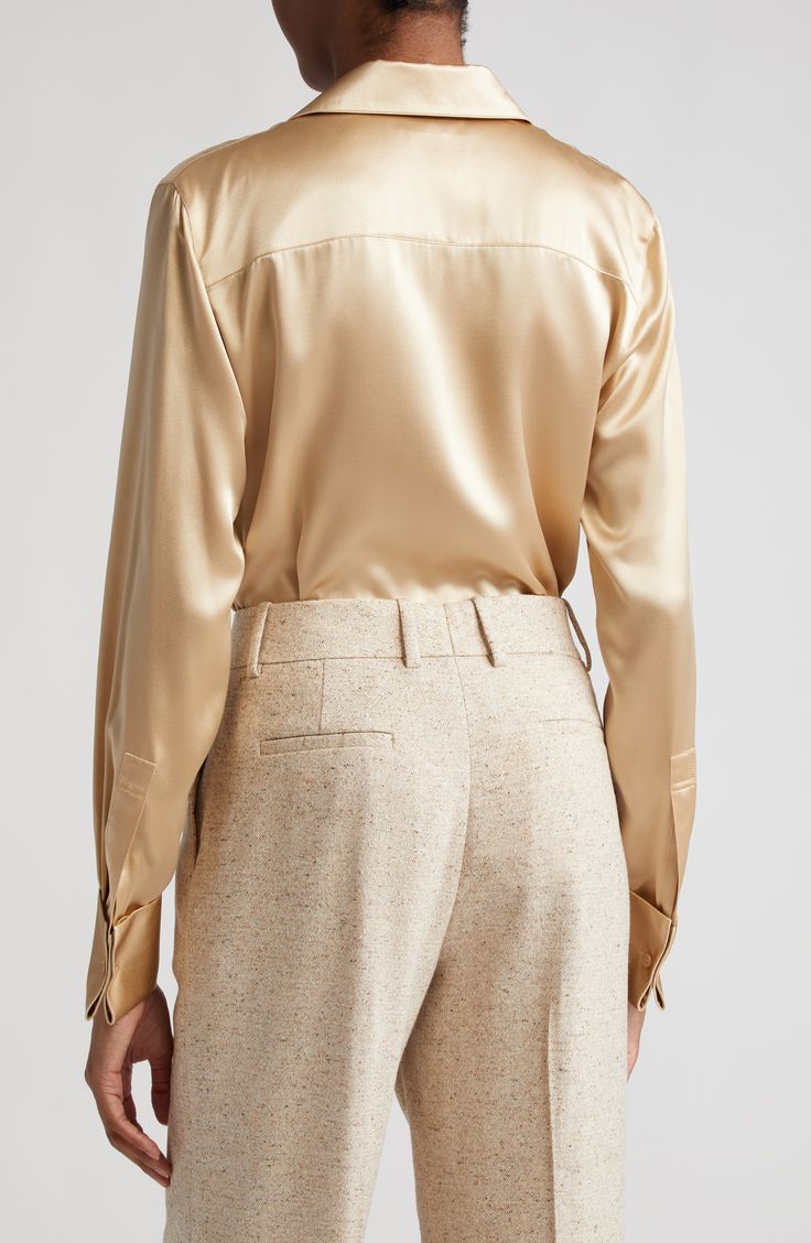 French cuffs add an extra dash of elegance to a lustrous blouse cut from liquid silk. 27" length (size medium) Hidden-button placket Spread collar Long sleeves with one-button French cuffs 100% silk Dry clean Imported Designer Clothing