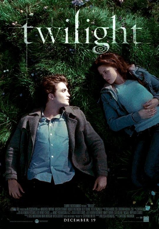 the twilight movie poster with two people laying in grass