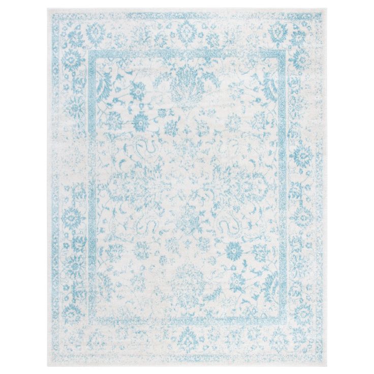 a blue and white rug with an ornate design on the bottom, in front of a white background