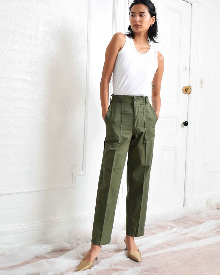 "Vintage army green utility slacks. High waist. Straight leg. Two side pockets. Two back pockets. Zipper fly. Fabric: 50% Cotton, 50% Polyester See dropdown menu for available sizes. Inseam varies between 29\" to 31\". Waist: 25.5\" Hips: 38\" Rise: 12\" Waist: 27\" Hips: 38\" Rise: 12\" Waist: 28\" Hips: 38\" Rise: 12\" Excellent vintage condition. Please note that each pair has unique distressing and subtle signs of wear that sometimes include small stains or minor mended areas. Photo represen Army Trousers, Fatigue Pants, Army Fatigue, Office Pants, Army Green, Business Casual, High Waist, Straight Leg, Pants For Women