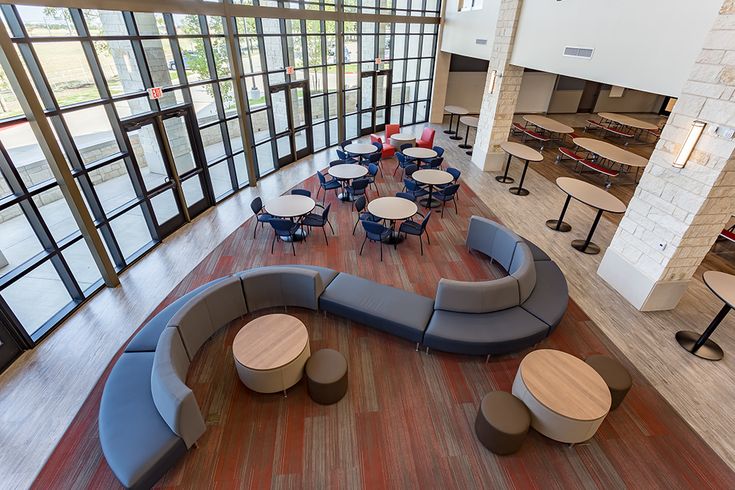 a large open room with tables and couches