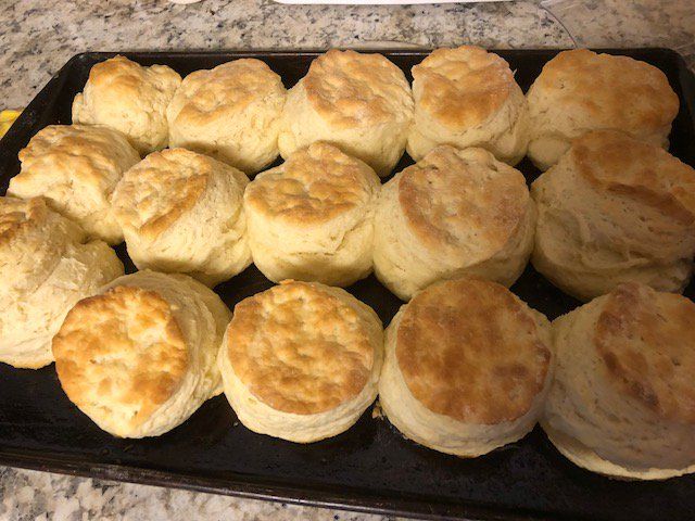 some biscuits are sitting on a black tray