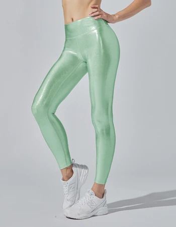 Make a statement with the iridescent fabric of the Marvel Legging. Marvel at the sheen on this legging and feel powerful and pretty at the same time. Show off at the gym or on the street.    High waistband lined with power mesh  Self: 80% NYLON 20% SPANDEX  Mesh lining  Made in USA  Model is wearing a size SMALL MACHIN Metallic Athleisure Leggings For Workout, Metallic Sporty Leggings For Gym, Sporty Metallic Leggings For Sports, Metallic Stretch Leggings For Gym, Metallic Athleisure Leggings For Gym, Metallic Stretch Leggings For Sport, Metallic Athleisure Bottoms For Sports, Metallic Athleisure Bottoms For Workout, Metallic Fitted Sporty Leggings