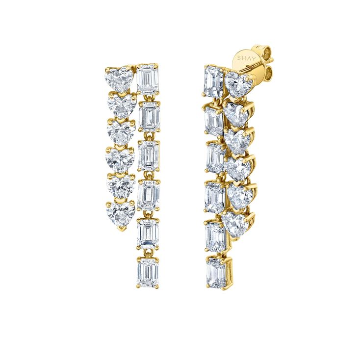 ICE COLLECTION: The SHAY Double Diamond Heart & Emerald Cut Waterfall Earrings. Details: 18K Gold White Diamonds: 7.09cts Length: 1.2mm Width: .2mm Natural, untreated gemstones CONTACT us to further customize Product Number: SE321 All products are made to order within 4 - 6 weeks. All GBP & EUR pricing includes duties & taxes. We offer complimentary International shipping and 2 day shipping within the US. For estimated delivery lead times, please see our shipping guide in the footer. LIVE CHAT w Shay Jewelry, Waterfall Earrings, Diamond Wall, Double Diamond, Nameplate Necklace, Pinky Ring, Emerald Cut Diamonds, Lovely Jewellery, Rose Gold Diamonds