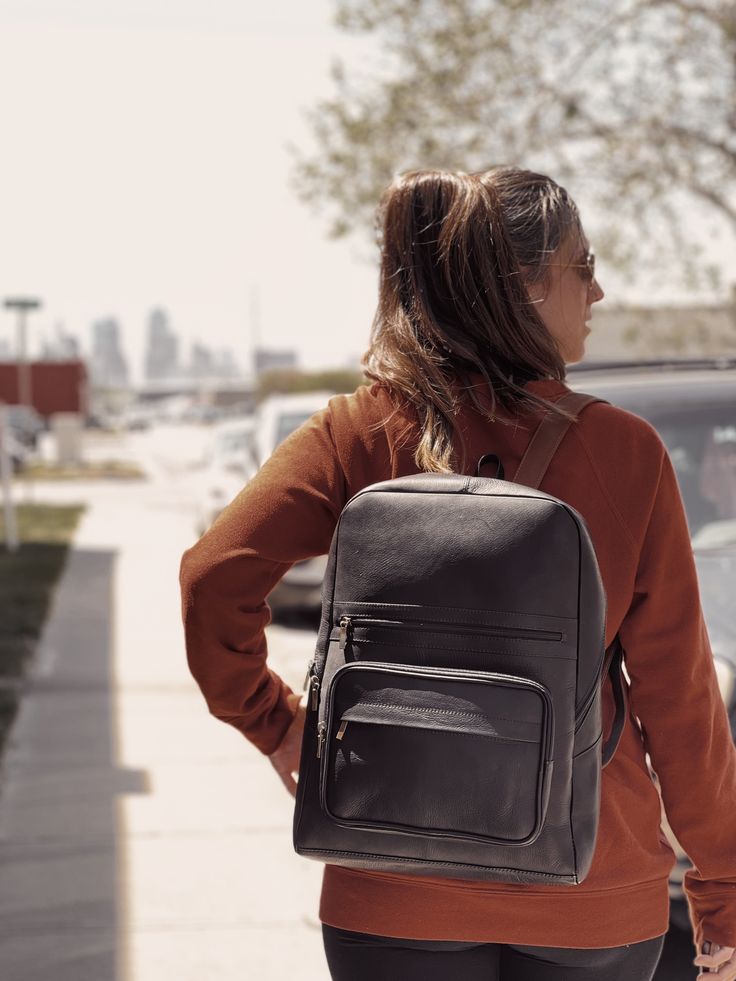 Carefully crafted by artisans in the highlands of Ecuador, our Leather Commuter Backpack is produced in small batches with high-quality materials. Designed to withstand everyday use and effortlessly accompany you on your commutes to work, class, and travels. Bring all of your essentials and get ready for a lifetime of adventures. Featuring a luggage strap for travel ease, adjustable straps, three external zippered pockets, one internal zippered pocket, and a padded pocket for your laptop up to 1 Rectangular Waxed Finish Backpack For On-the-go, Modern Standard Backpack With Waxed Finish, Modern Waxed Finish Standard Backpack, Leather Backpack With Waxed Finish For On-the-go, Functional Leather Backpack With Waxed Finish For Daily Use, Leather Backpack With Waxed Finish, Travel Backpack Satchel, Classic Backpack With Luggage Sleeve For Everyday Use, Casual Leather Backpack For Everyday And Back To School