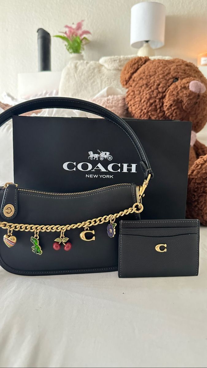 Styling Coach Bag, Coach Aesthetic Bag, Coach Purse Charms, Coach Astetic, Couch Bags Coach Handbags, Coach Bag Accessories, Coach Bags With Charms, Coach Bag With Cherry Charm, Coach Bag With Charms