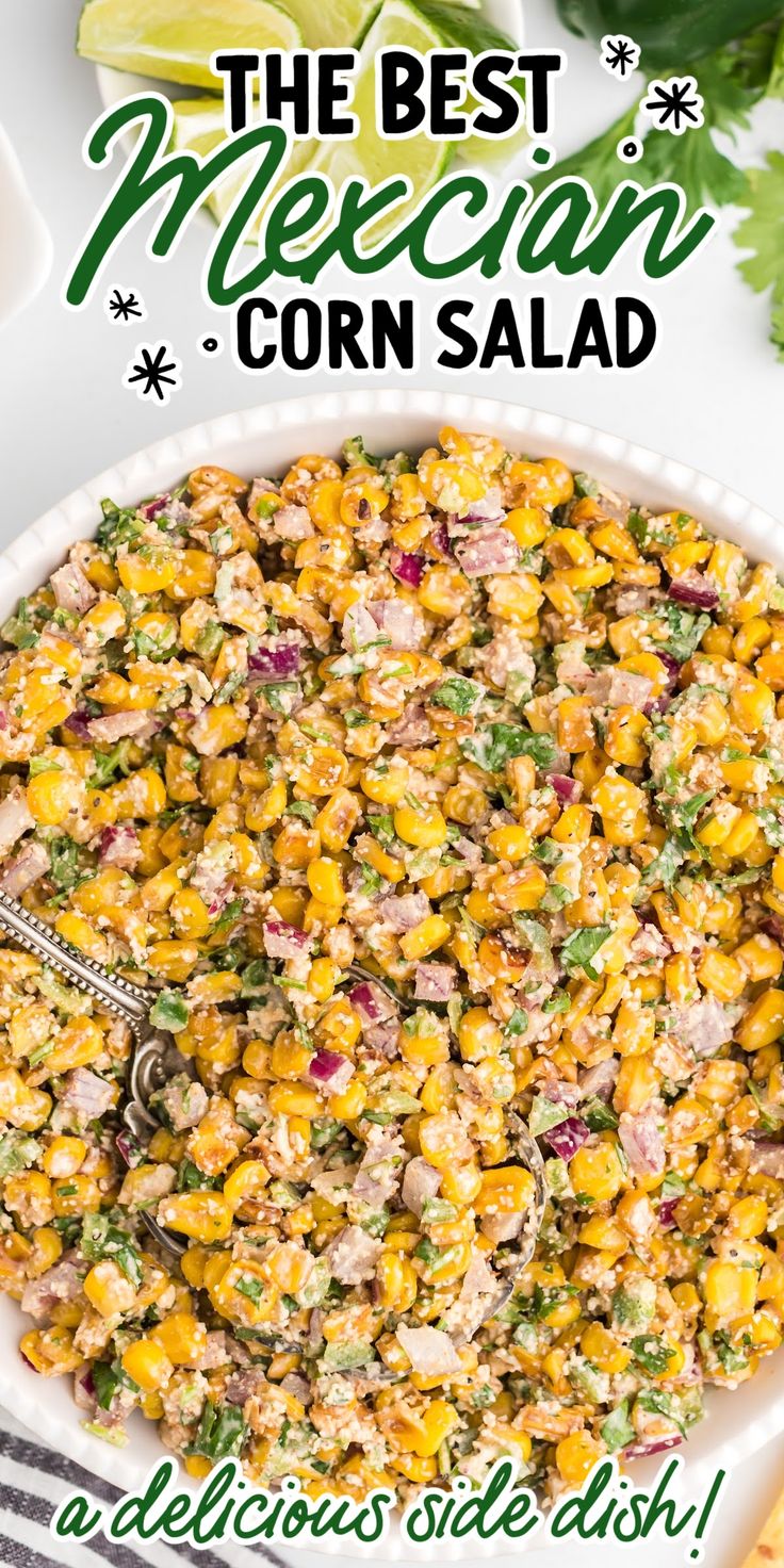 Close-up overhead shot of Mexican corn salad garnished with parsley then topped with Cotija cheese and lime slices. Jalapeno Corn Salad Recipe, Mexican Corn Salad With Fritos, Mexican Corn Skillet, Mexican Street Corn Jalapeno Poppers, Hot Corn Side Dish, Corn And Jalapeno Side Dish, Trader Joes Side Dish Recipes, Sides To Go With Tri Tip, Side Dishes For Enchiladas