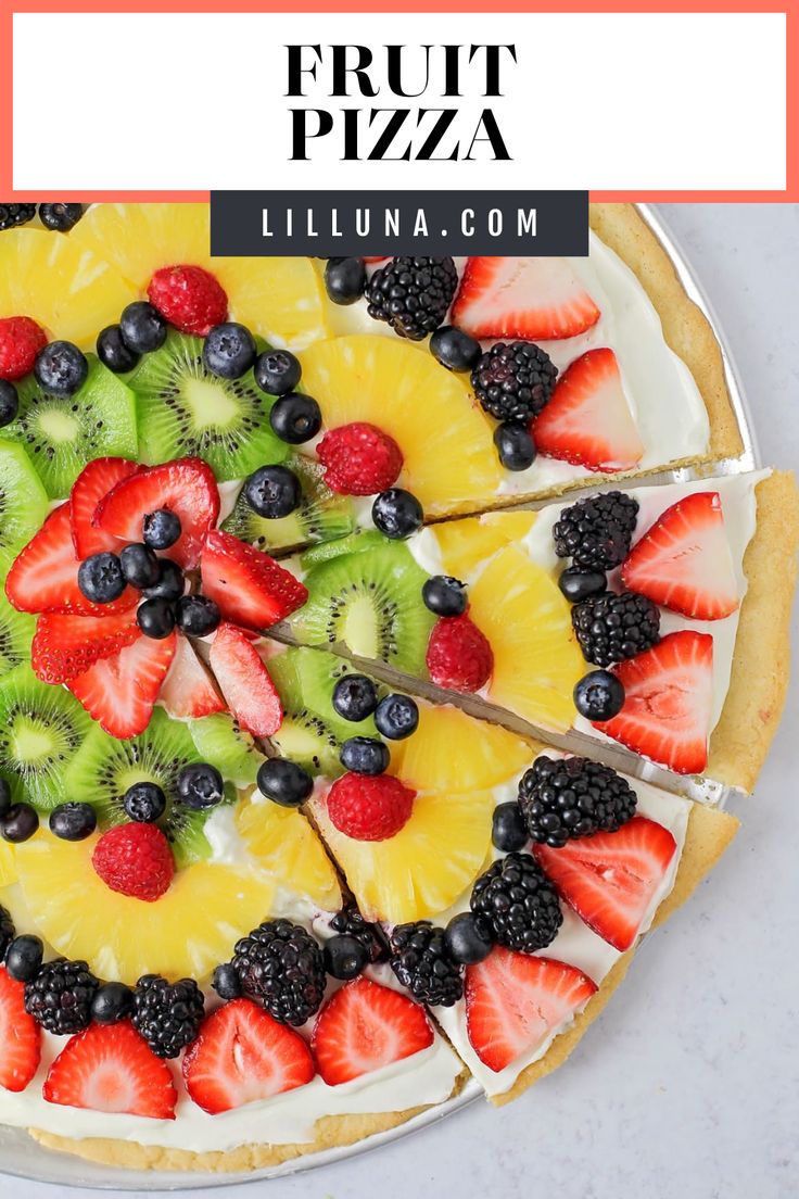 a fruit pizza with kiwis, raspberries and pineapple on top