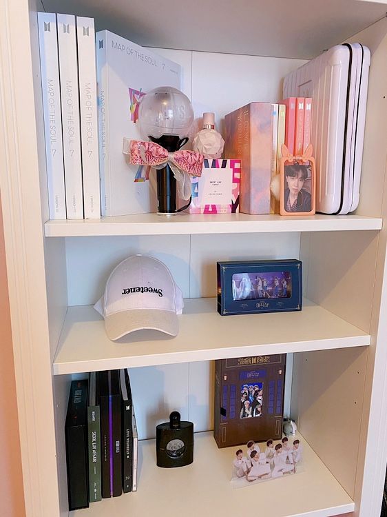 a book shelf with books and other items on it