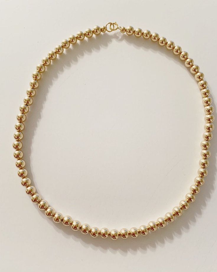 This listing is for a beaded necklace with 14k gold beads. Bead size shown here is 3mm. The beads are available in sizes 2mm to 6mm. Clasp is also 14k gold filled. If you want to see the difference in size of beads please send me a message. Please note the 2mm are very tiny, the size of seed beads from a craft store. Most popular sizes I sell are 3mm and 4mm. please review my shop policies regarding returns, shipping, and international shopper info before purchasing. Minimalist Gold Beaded Necklaces With Tiny Beads, Dainty Beaded Necklaces With Gold Beads, Dainty Gold Beaded Necklaces, Minimalist Gold Beaded Chain, Gold Single Strand Beaded Bracelets With Round Beads, Beaded 14k Gold Filled Necklace With Round Beads, Beaded 14k Gold Filled Round Necklaces, 14k Gold Filled Beaded Necklaces With Round Beads, Dainty Choker With Round Gold Beads