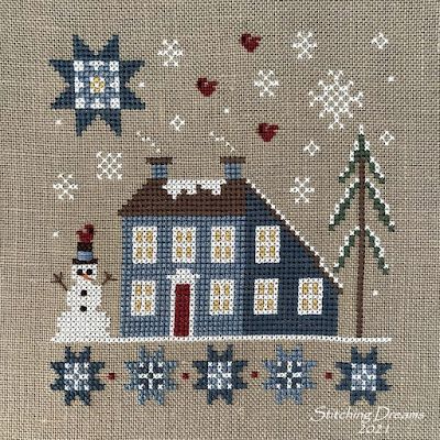 a cross stitch pattern with a house and snowman