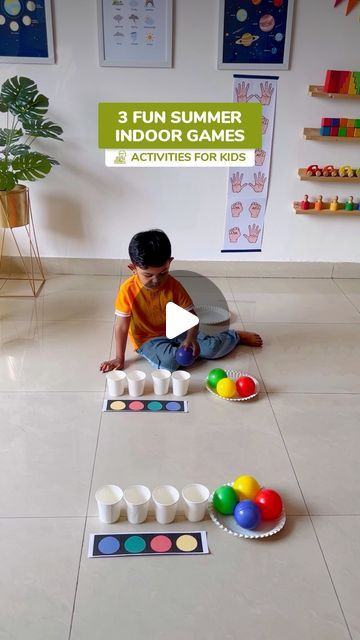 a little boy sitting on the floor playing with some sort of toys in front of him