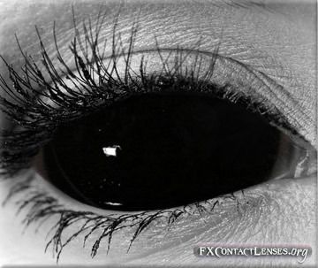 black and white photograph of an eye with long lashes