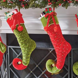 christmas stockings hanging from a fireplace mantel