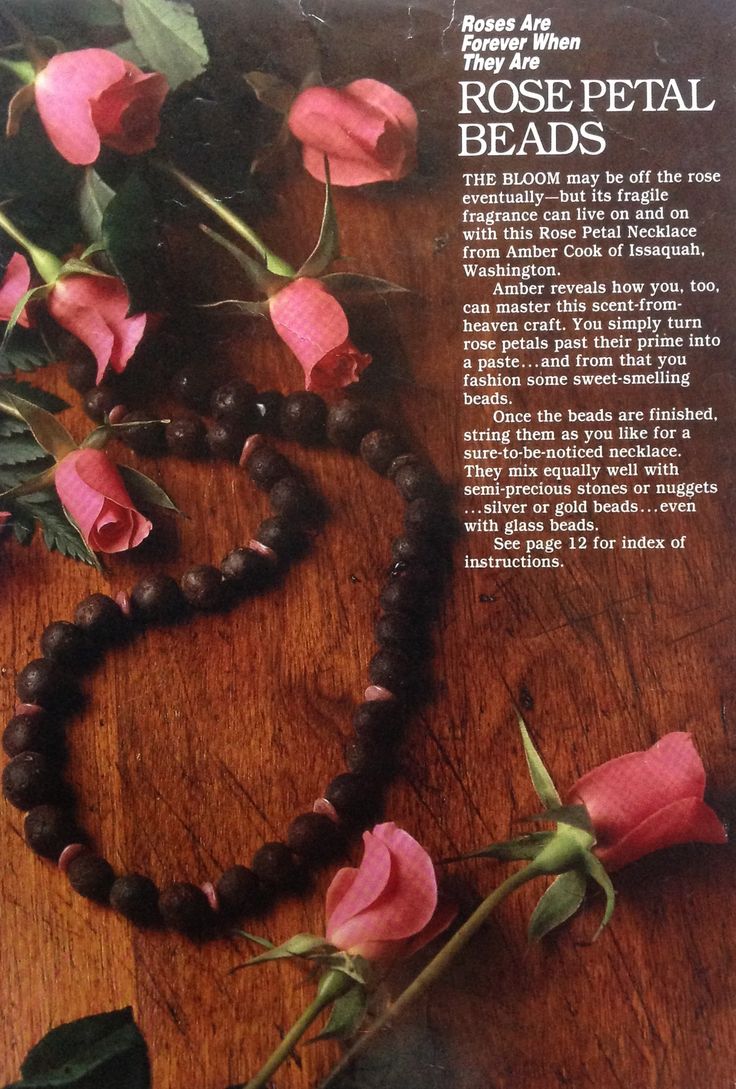 an advertisement for rose petal beads on a table