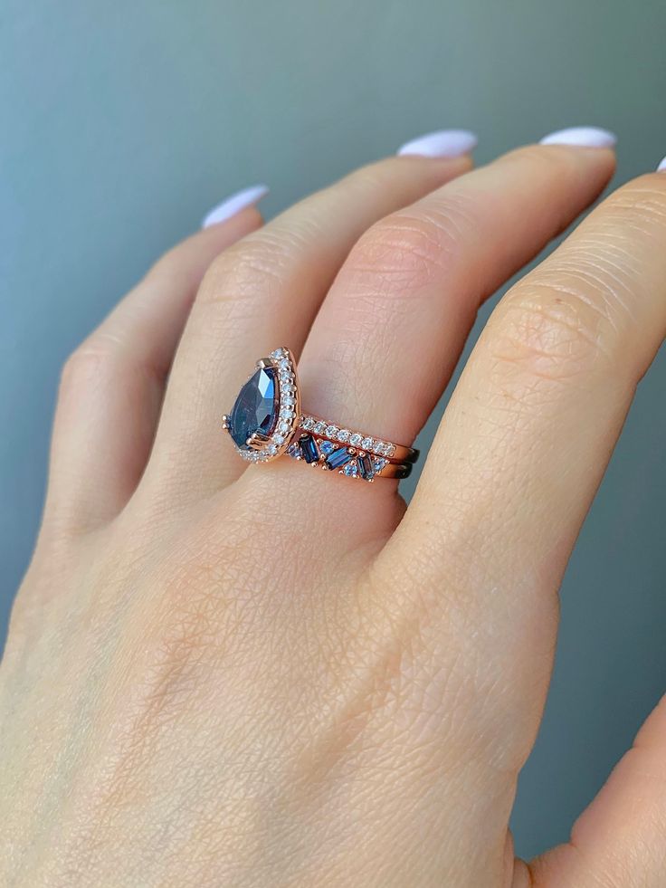 ✦Gorgeous London Blue Topaz Ring 2 Piece Set✦ ✧ Base Metal: 925 Sterling Silver ✧ Plating: 14K Rose Gold Vermeil ✧ Accented with Natural Crystals ✧ Average band width: 2.1 mm ✧ Center Stone: Topaz ✧ Color: London Blue ✧ Stone Cut: Pear ✧ Gem size: 8.0 x 6.0 mm ✧ Carat Weight: 1.21 ct. ✧ Gemstone creation: Natural ✧ Hardness: 8 (Mohs scale) ✧ Gemstone Origin: Switzerland ✧ Sizes 3.5-11.25 ✧ This ring set will arrive ready to gift in a Kherish Box. ✧ Due to the nature of the handmade process, each piece may slightly vary in color, size, shape, and contain natural inclusions. Every piece is gorgeous and one of a kind. *Please refer to photos for reference.  ✦ This Artist Has Autism✦ Every item you order from Kherish is handcrafted and packed by an artist with autism in RVA. Thanks to your sup Blue Topaz Engagement Ring, Topaz Engagement Ring, London Blue Topaz Ring, Topaz Color, November Birthstone, Richmond Va, Anniversary Gift For Her, Put A Ring On It, Blue Topaz Ring