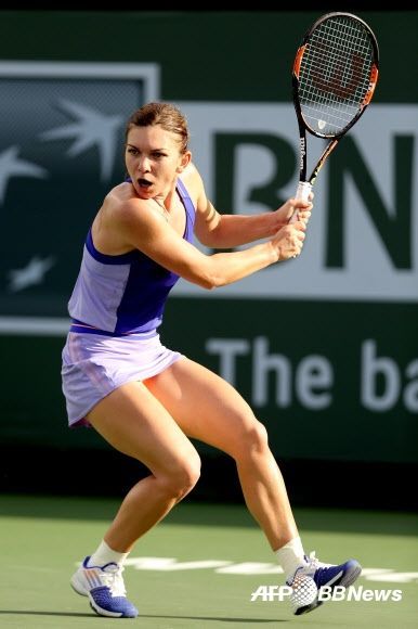 a female tennis player in action on the court