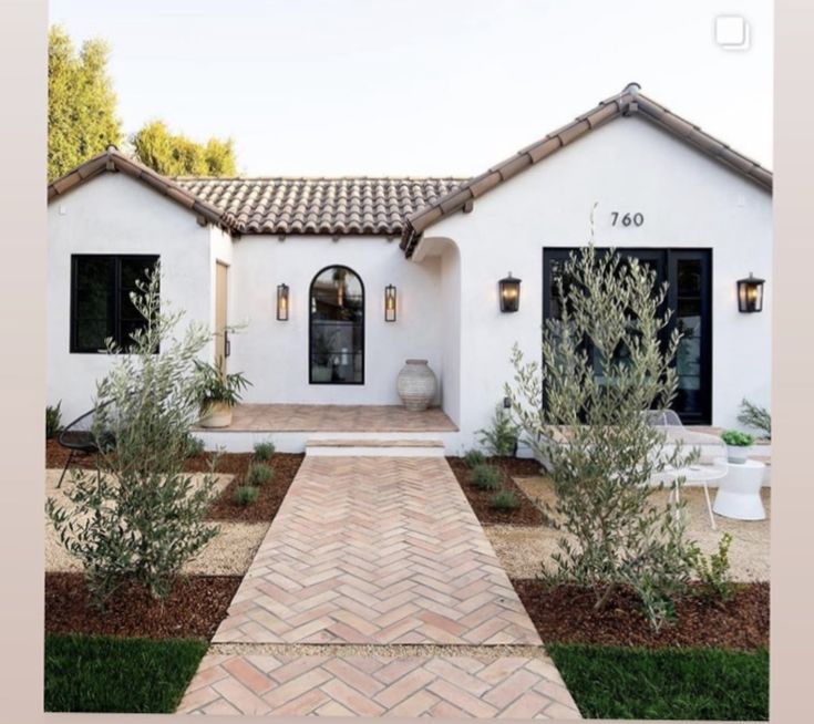 a white house with black doors and windows