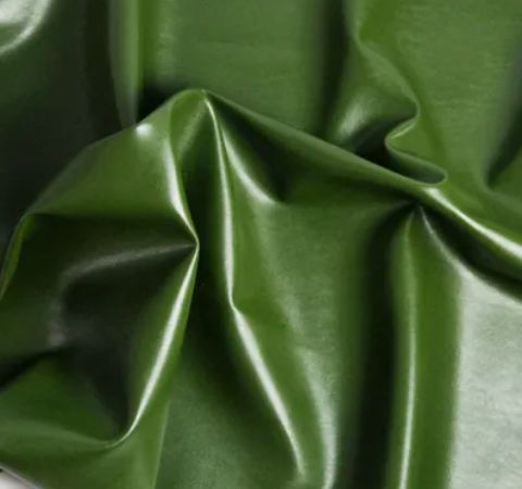 a close up view of a green leather material that looks like it has been dyed